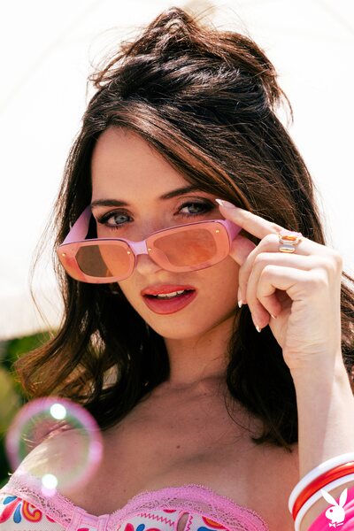 Brooke Tilli Undresses Poolside In Patterned Bikini And Pink Wrap - photo 01