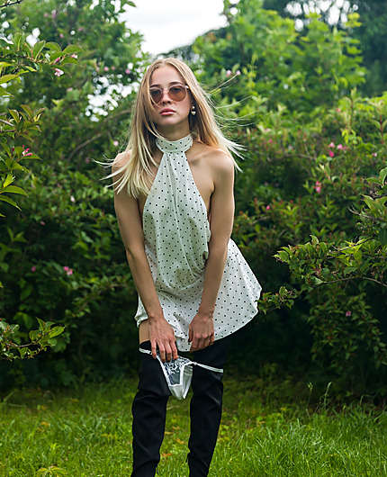 Nikki Hill In A White Polka Dot Dress In The Summer Garden