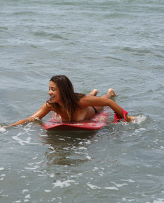 Yanira Prado Pics On The Beach With Surfboard And Playful Charm