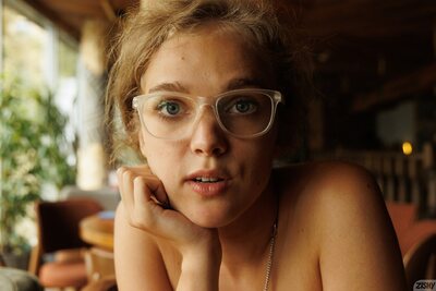 Xena Khrabry Teasing In A Cozy Cafe Wearing Glasses And Denim - photo 00