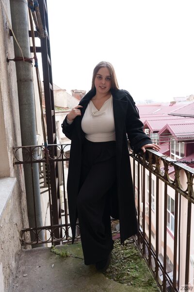 City Balcony Confidence With Adele Cotton In Black Outfit - photo 00